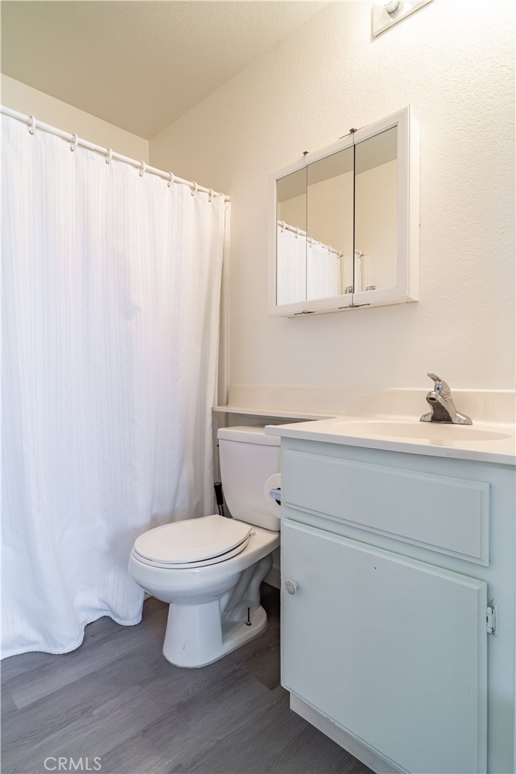 11688 Cornell Street Adelanto, CA 92301 - Photo 18 of 40 a bathroom with a sink a toilet and a mirror