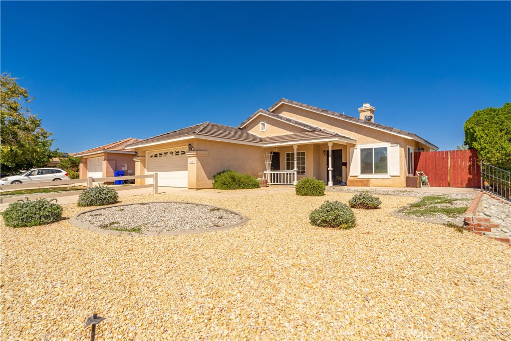 11688 Cornell Street Adelanto, CA 92301 - Photo 2 of 40 a front view of a house with a yard