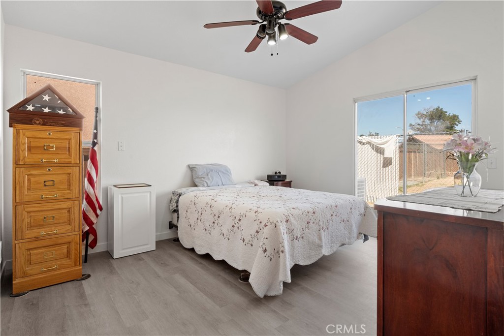 11688 Cornell Street Adelanto, CA 92301 - Photo 22 of 40 a bedroom with a bed and a dresser