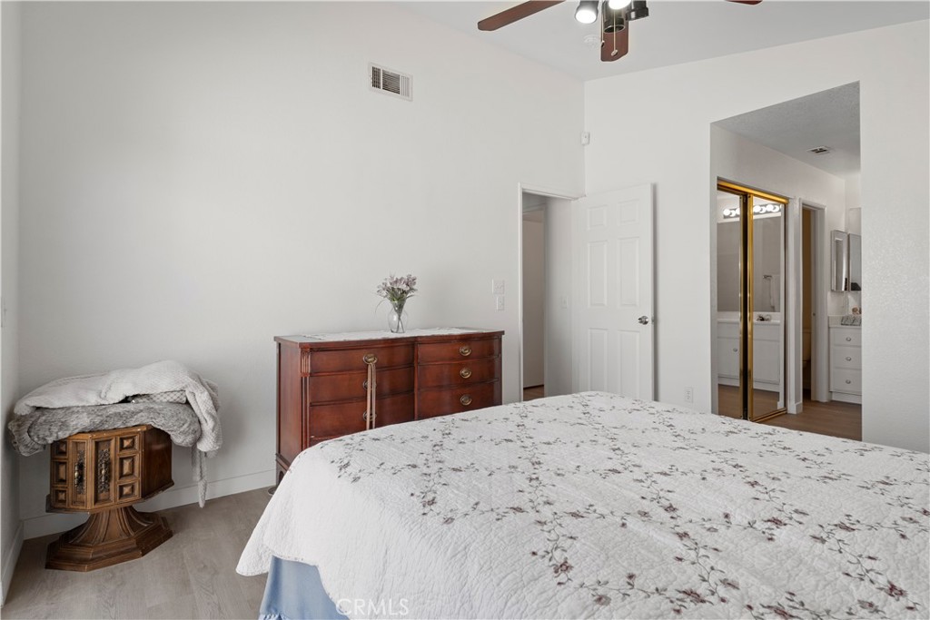 11688 Cornell Street Adelanto, CA 92301 - Photo 24 of 40 a bedroom with a bed and a table