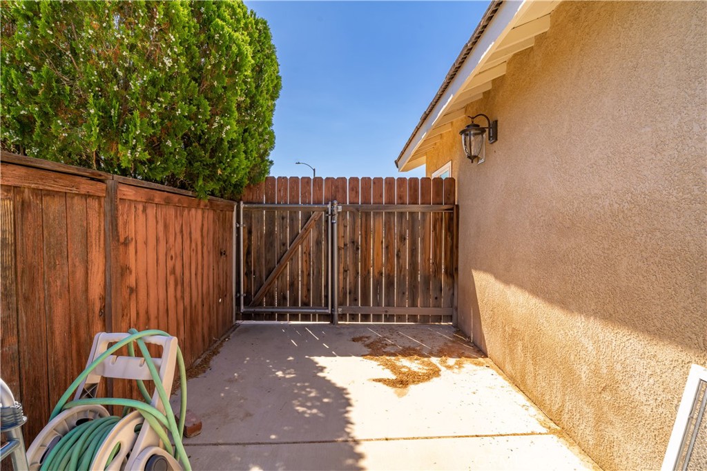 11688 Cornell Street Adelanto, CA 92301 - Photo 28 of 40 a view of a door with a small yard