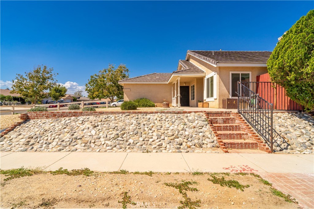 11688 Cornell Street Adelanto, CA 92301 - Photo 3 of 40 a front view of a house with a yard