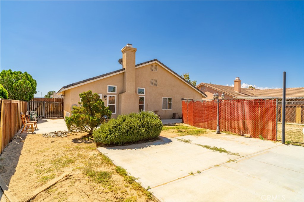 11688 Cornell Street Adelanto, CA 92301 - Photo 31 of 40 a front view of a house with a yard