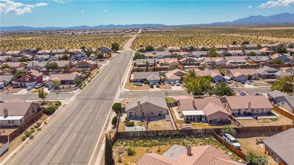 11688 Cornell Street Adelanto, CA 92301 - Photo 38 of 40 an aerial view of residential houses with outdoor space