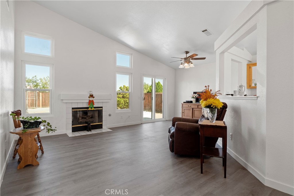 11688 Cornell Street Adelanto, CA 92301 - Photo 6 of 40 a living room with furniture and a fireplace