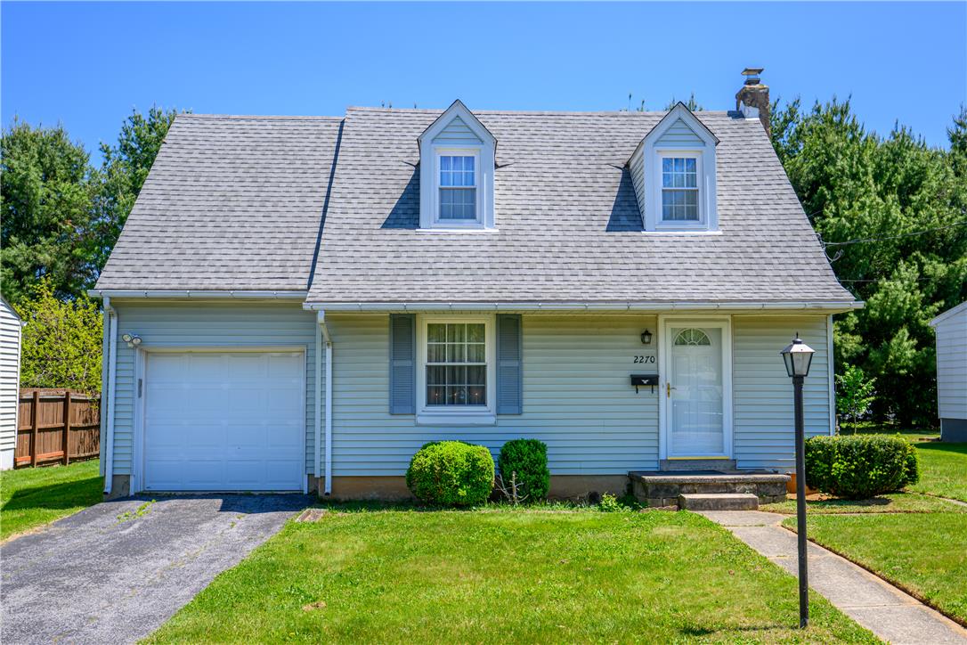 This charming residence features a well-maintained exterior and a welcoming entryway.