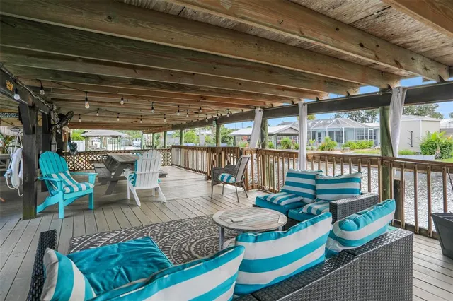 a outdoor living space with furniture and a fireplace