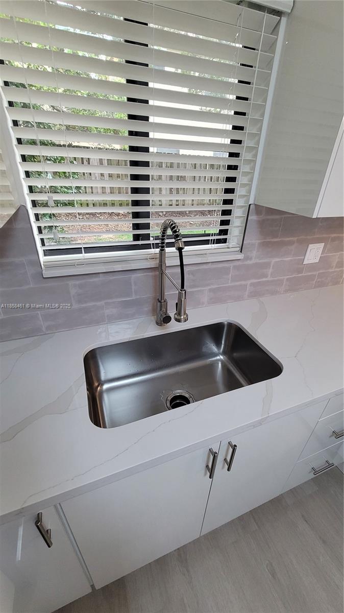 22731 Southwest 88th Place, Unit 101 Cutler Bay, FL 33190 - Photo 13 of 59 a close view of sink and a faucet
