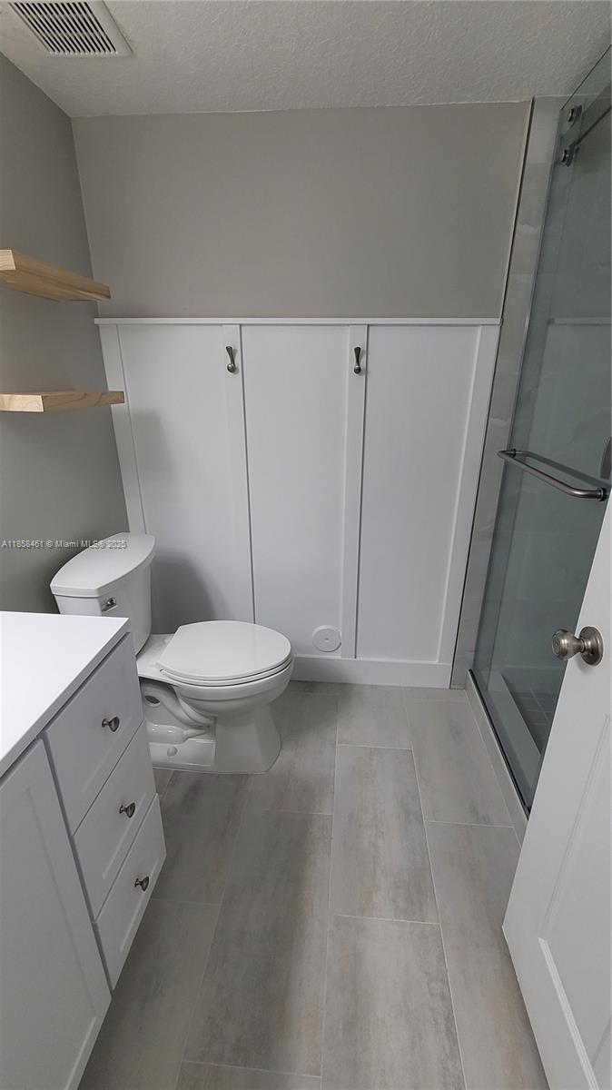 22731 Southwest 88th Place, Unit 101 Cutler Bay, FL 33190 - Photo 27 of 59 a bathroom with a toilet and a sink