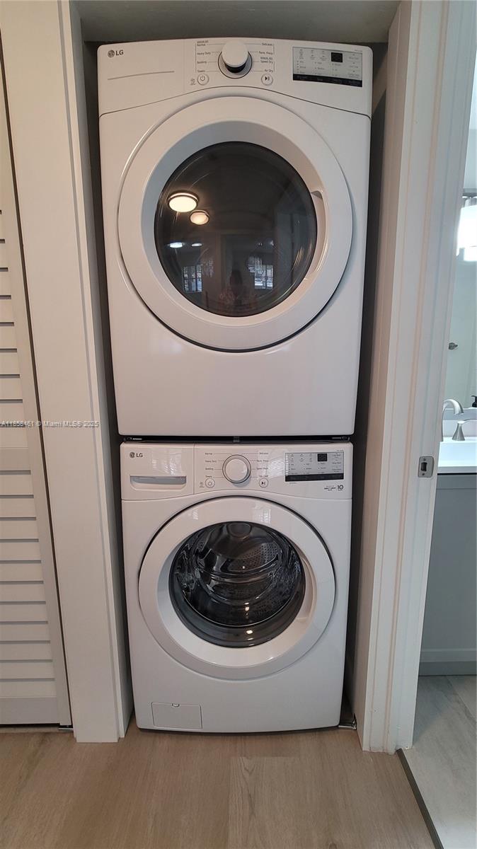 22731 Southwest 88th Place, Unit 101 Cutler Bay, FL 33190 - Photo 32 of 59 a utility room with dryer and washer