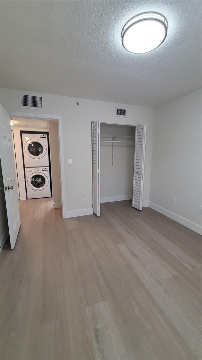 22731 Southwest 88th Place, Unit 101 Cutler Bay, FL 33190 - Photo 36 of 59 an empty room with a empty space and mirror