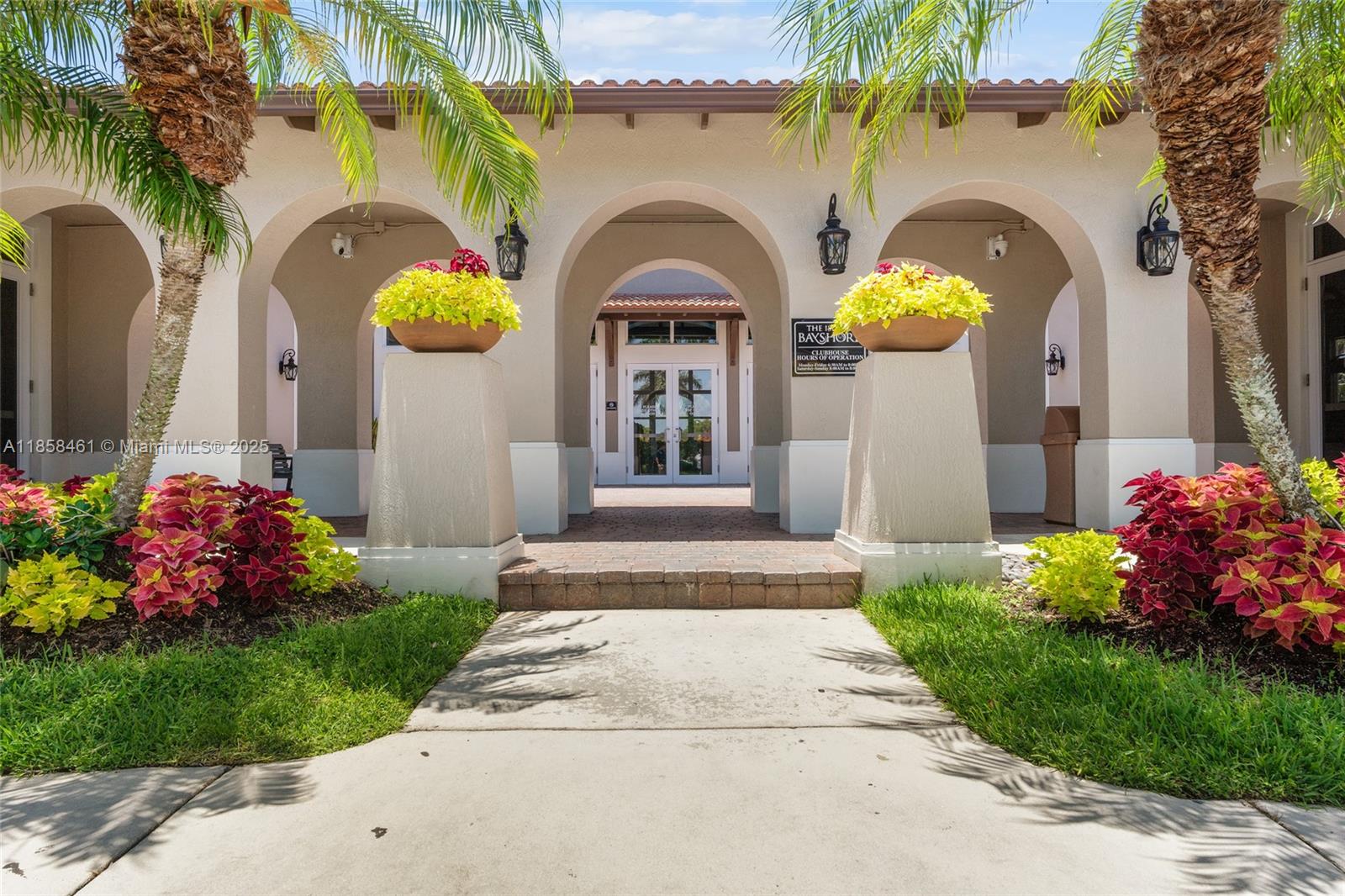 22731 Southwest 88th Place, Unit 101 Cutler Bay, FL 33190 - Photo 45 of 59 a front view of a house with a porch