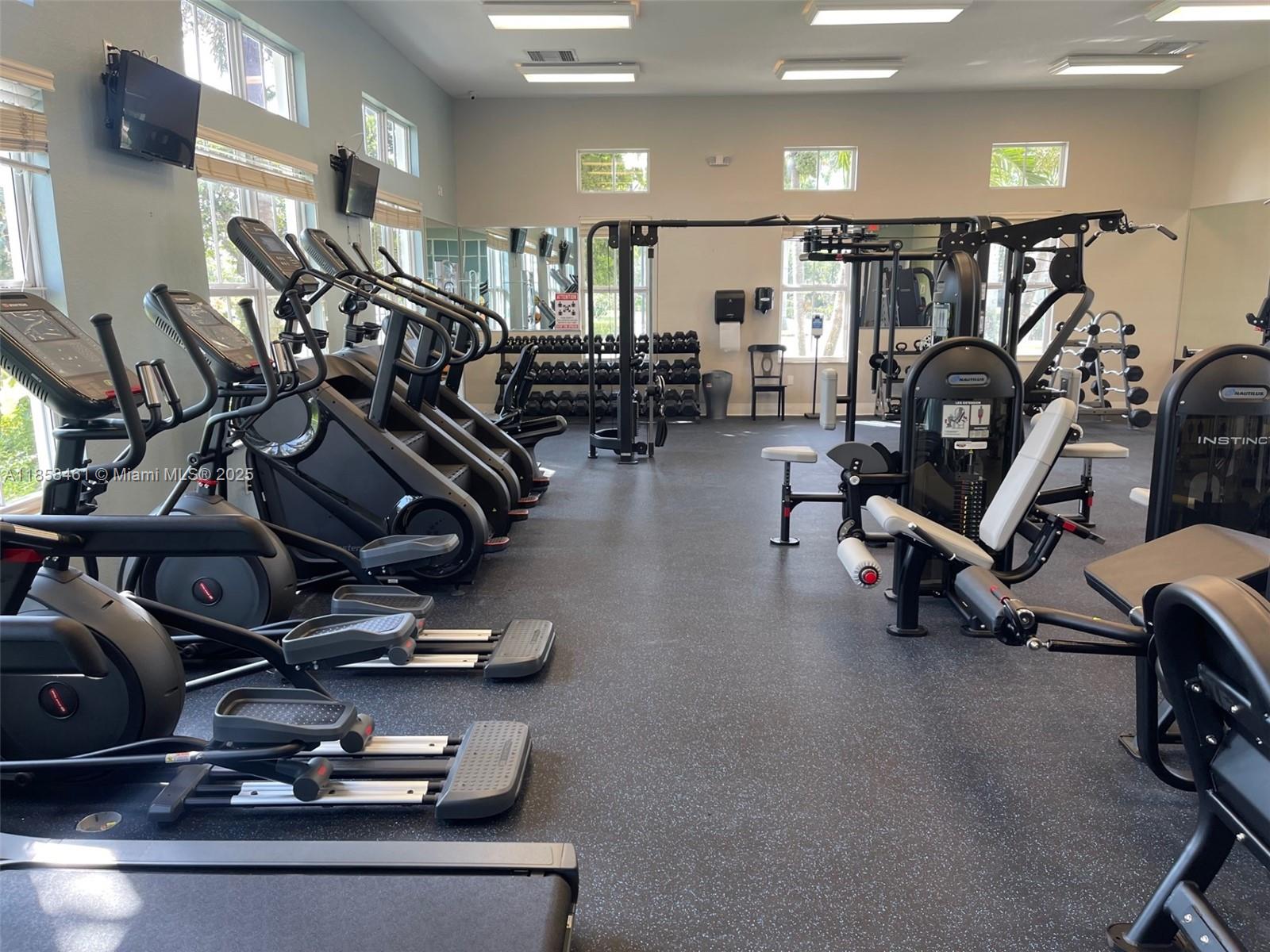 22731 Southwest 88th Place, Unit 101 Cutler Bay, FL 33190 - Photo 48 of 59 a view of a room with gym equipment