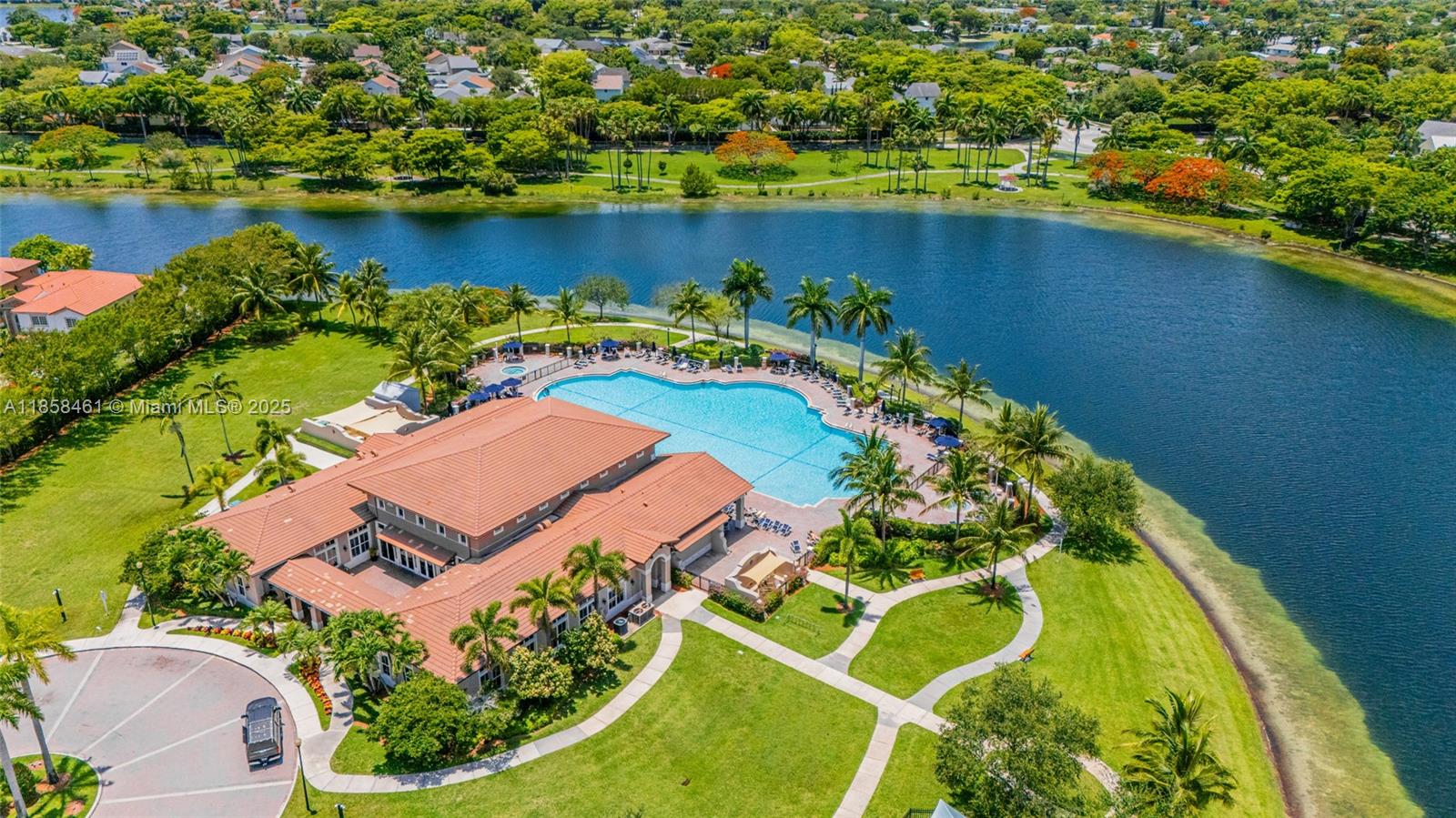 22731 Southwest 88th Place, Unit 101 Cutler Bay, FL 33190 - Photo 56 of 59 an aerial view of a house with a lake view