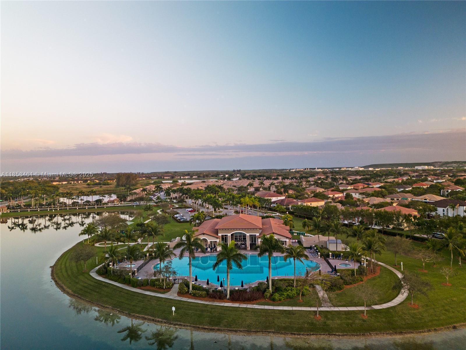 22731 Southwest 88th Place, Unit 101 Cutler Bay, FL 33190 - Photo 59 of 59 a view of a lake with tall buildings