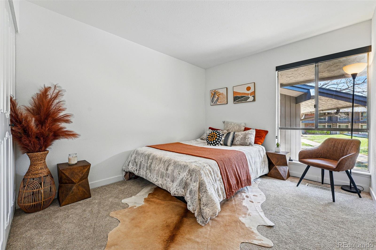 6495 East Happy Canyon Road, Unit 62 Denver, CO 80237 - Photo 17 of 23 a bedroom with bed and a window