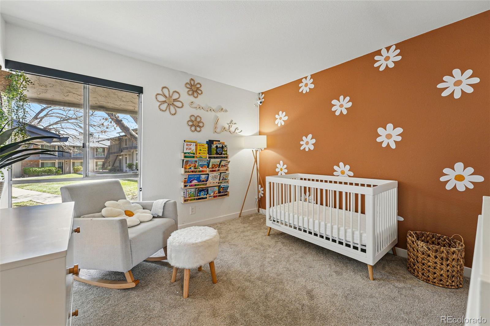 6495 East Happy Canyon Road, Unit 62 Denver, CO 80237 - Photo 18 of 23 a bedroom with furniture and a large window