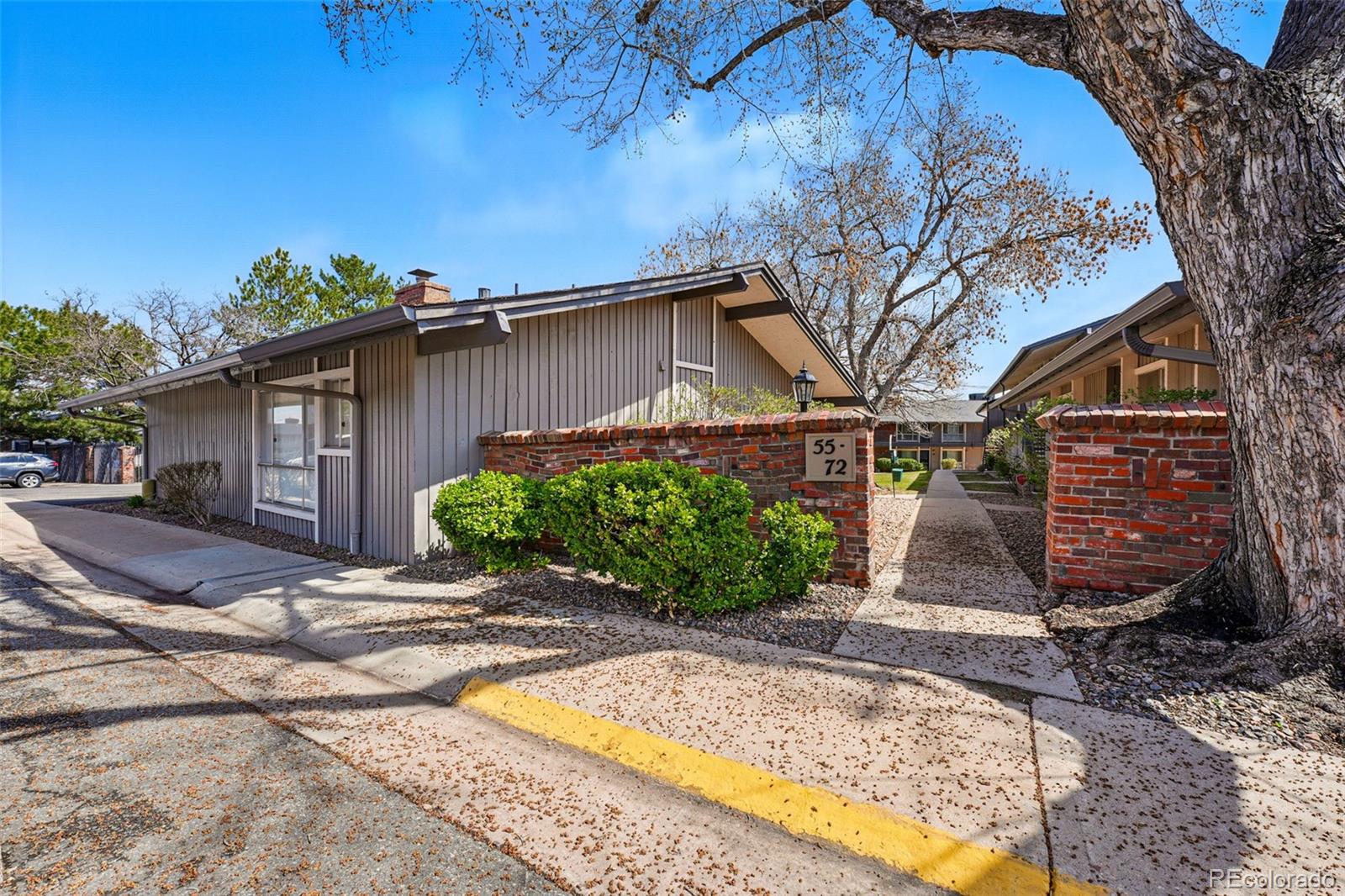 6495 East Happy Canyon Road, Unit 62 Denver, CO 80237 - Photo 22 of 23 a view of a house with a patio