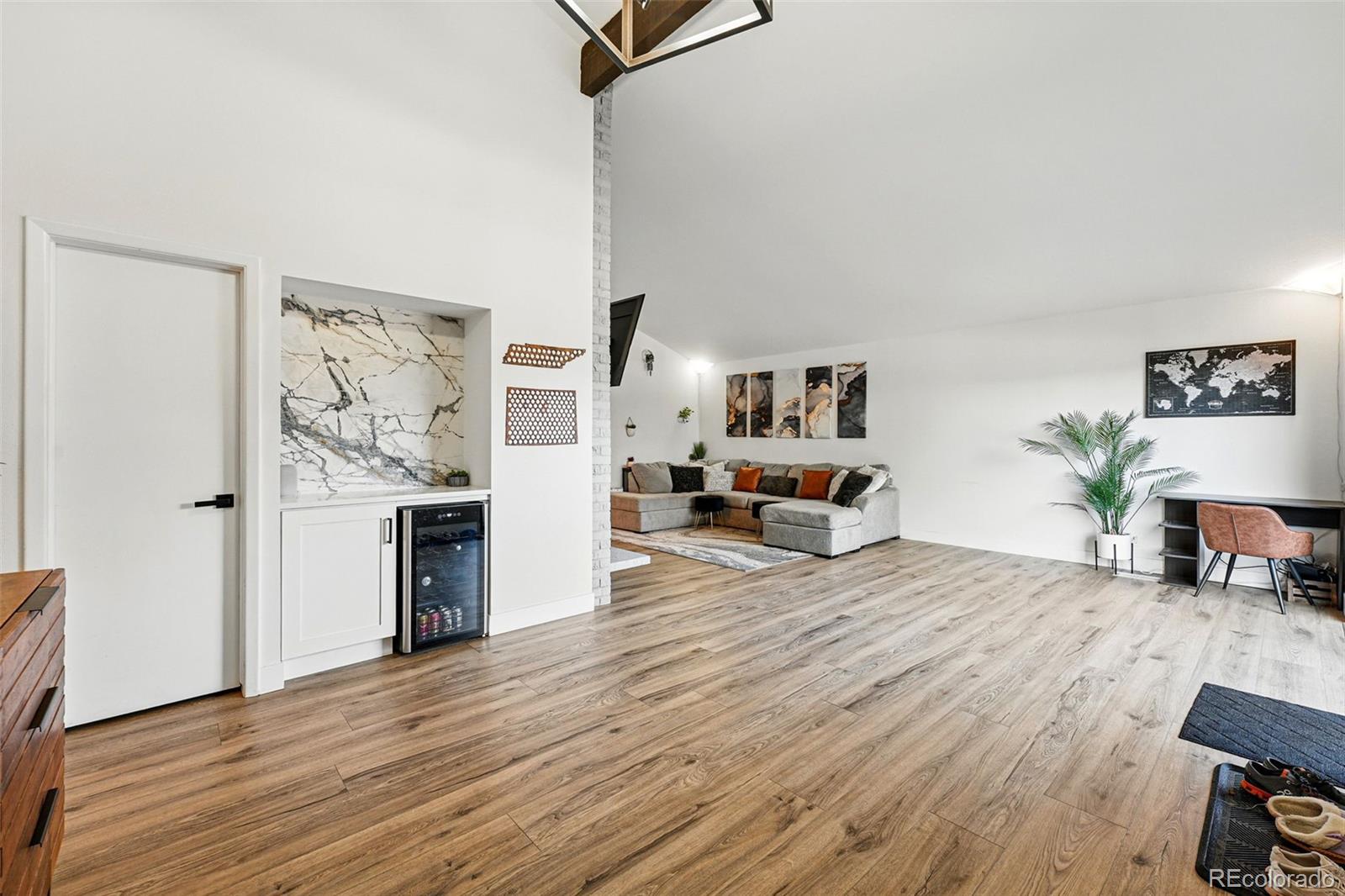 6495 East Happy Canyon Road, Unit 62 Denver, CO 80237 - Photo 6 of 23 a living room with furniture and a wooden floor