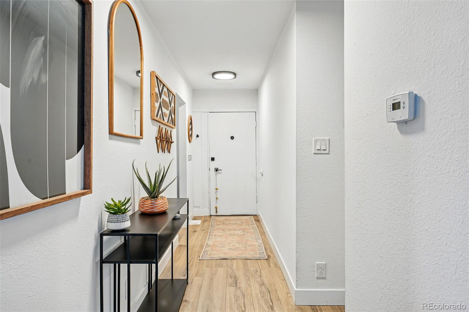 6495 East Happy Canyon Road, Unit 62 Denver, CO 80237 - Photo 9 of 23 a very nice looking room with a potted plant