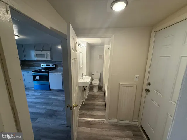 a view of an empty room and a window