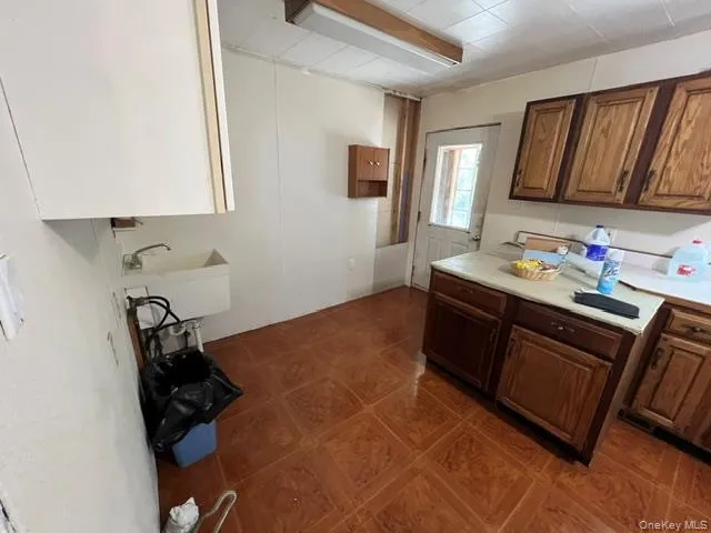 a kitchen with a sink appliances and cabinets