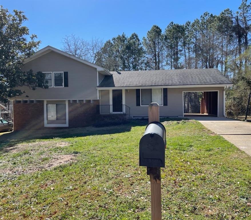 36 Old Post Road Jonesboro, GA 30238 - Photo 1 of 1 a front view of a house with yard and trees