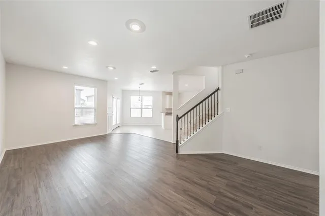 a view of kitchen with wooden floor and window
