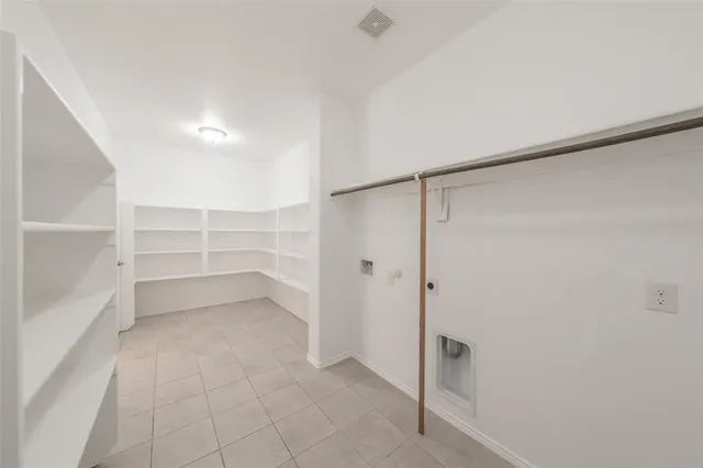 a view of an empty walk in closet