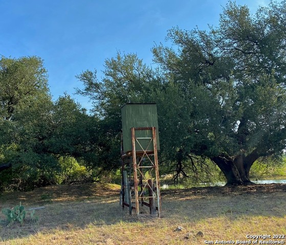 13220 Highway 1604 Loop San Antonio, TX 78263 - Photo 17 of 49 a house view with a garden space