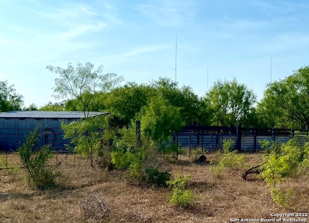 13220 Highway 1604 Loop San Antonio, TX 78263 - Photo 24 of 49 a backyard of a house with lots of green space