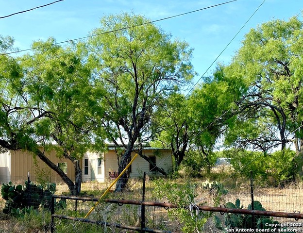 13220 Highway 1604 Loop San Antonio, TX 78263 - Photo 28 of 49 a backyard of a house with lots of green space