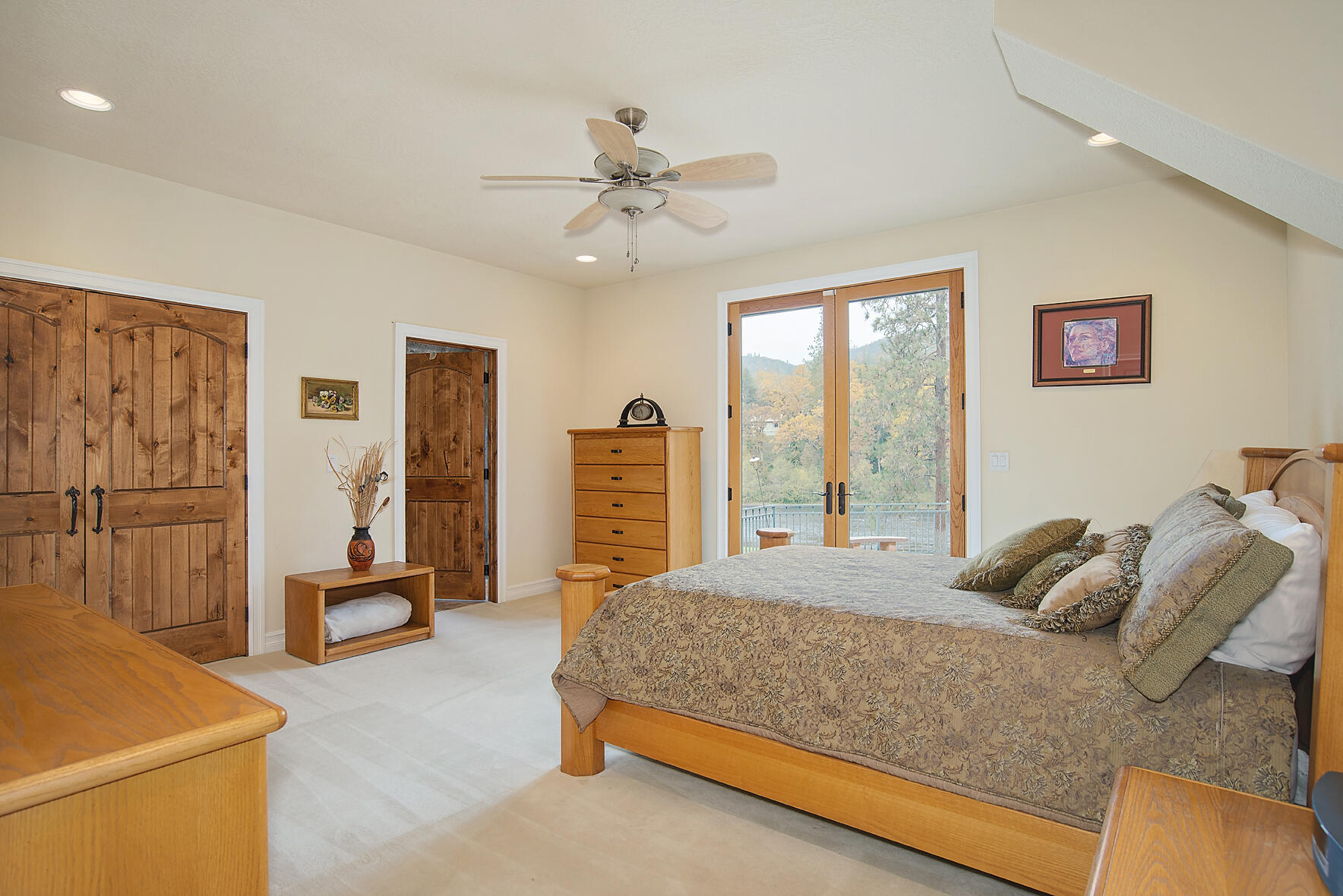 1665 Upper River Road Gold Hill, OR 97525 - Photo 14 of 48 a bedroom with a bed and wooden floor