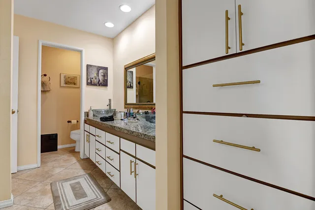 a bathroom with a double vanity sink and mirror