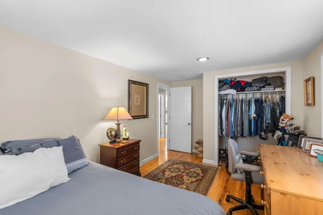 a bathroom with a sink mirror and toilet