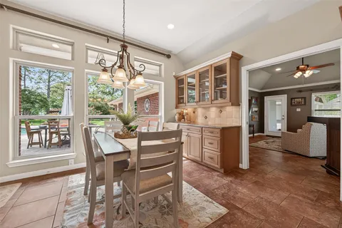 a view of a dining room with furniture window and outside view