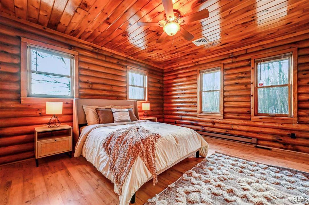 355 Tower Road Sugarloaf, PA 18249 - Photo 28 of 75 Bedroom 1 has laminate flooring, log walls, a wood