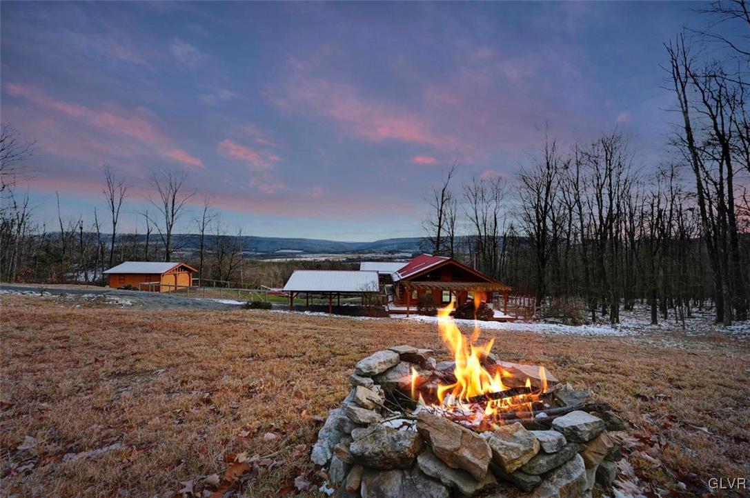 355 Tower Road Sugarloaf, PA 18249 - Photo 67 of 75 Dusk view of the firepit and landscape from the Cl