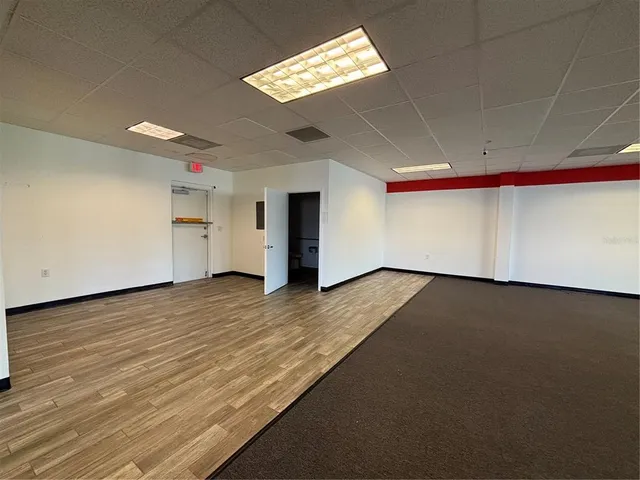 a view of empty room with windows