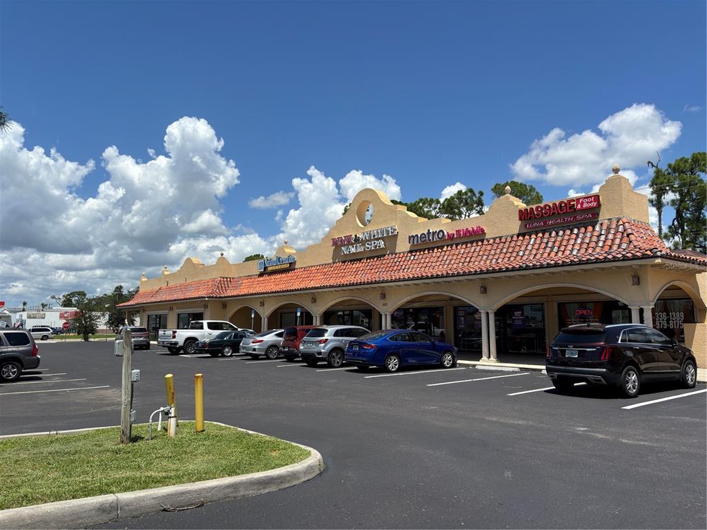 2672 Tamiami Trail, Unit 6B 7B Port Charlotte, FL 33952 - Photo 2 of 36 a car parked in front of a building
