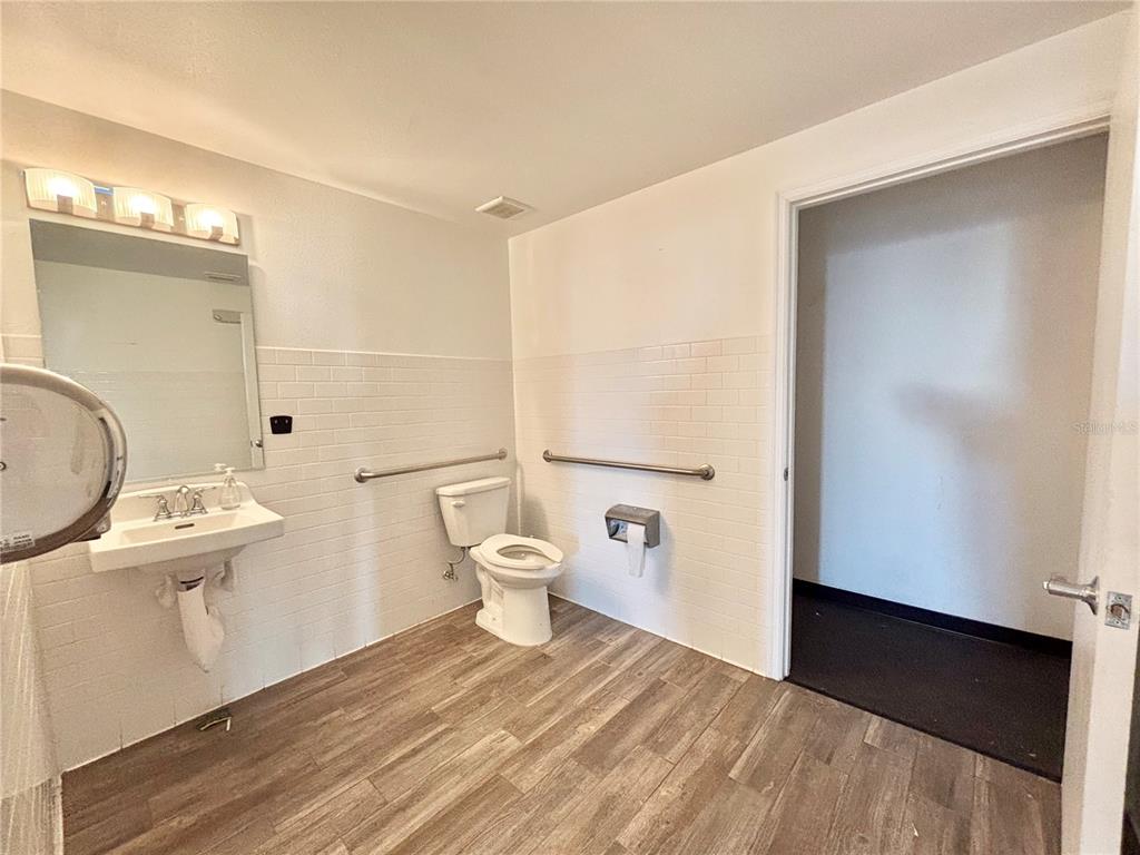 2672 Tamiami Trail, Unit 6B 7B Port Charlotte, FL 33952 - Photo 22 of 36 a bathroom with a toilet a sink and shower