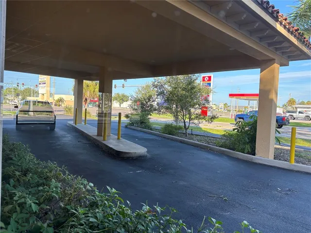 a view of a car parked front of a house