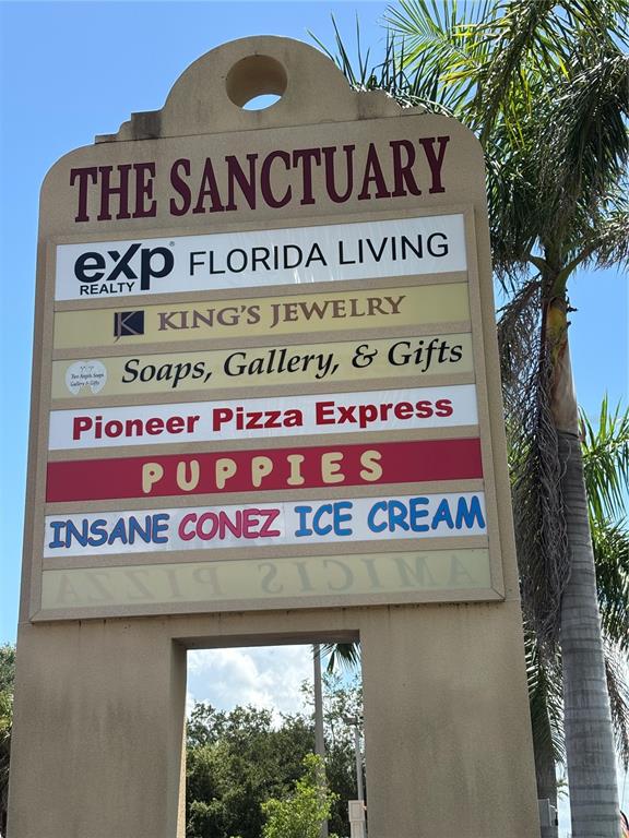 2672 Tamiami Trail, Unit 6B 7B Port Charlotte, FL 33952 - Photo 29 of 36 a sign on the side of a building