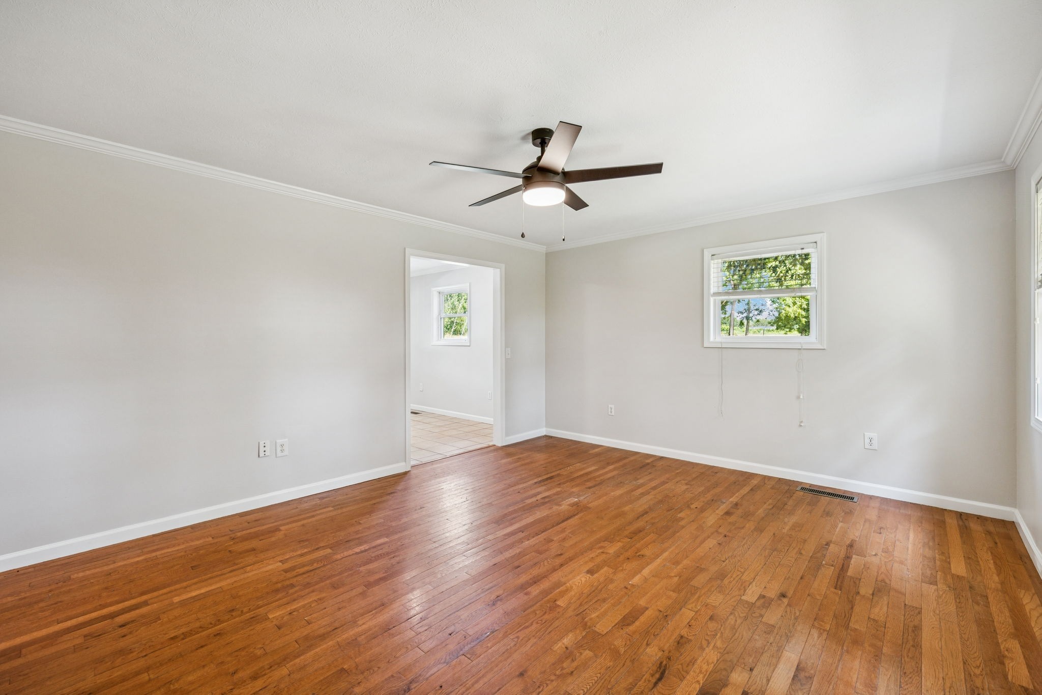 2585 Pow Road Baxter, TN 38544 - Photo 15 of 83 a view of empty room with wooden floor and fan