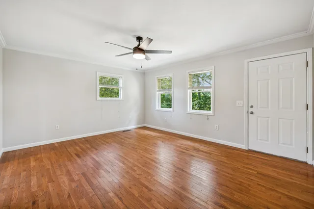 a kitchen with granite countertop a stove a sink and a window