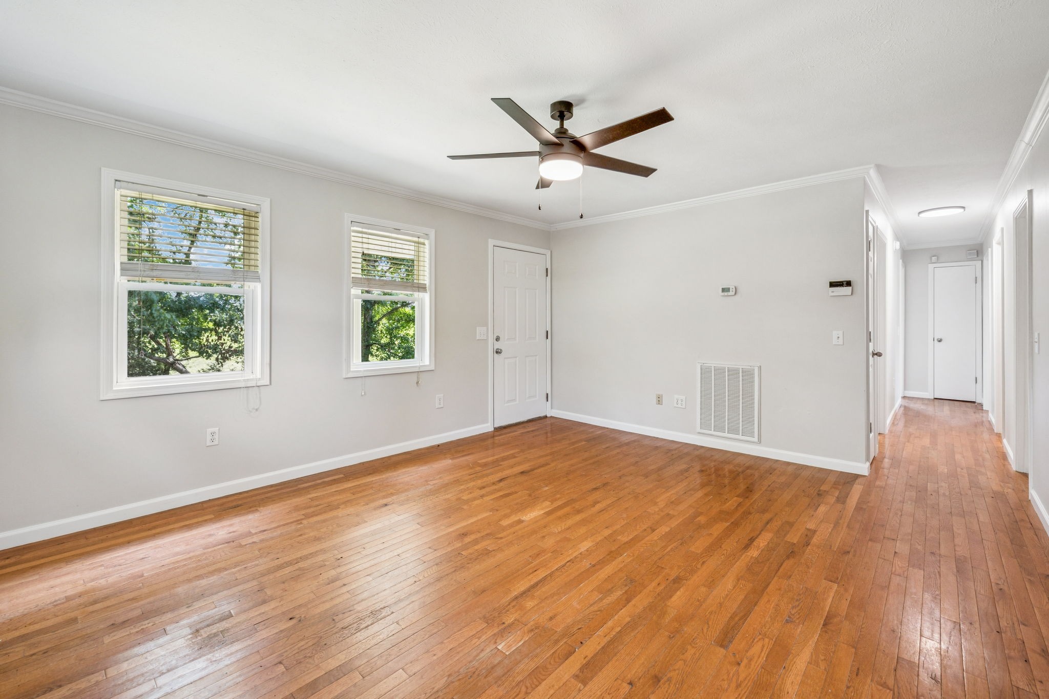 2585 Pow Road Baxter, TN 38544 - Photo 17 of 83 a view of empty room with wooden floor and fan