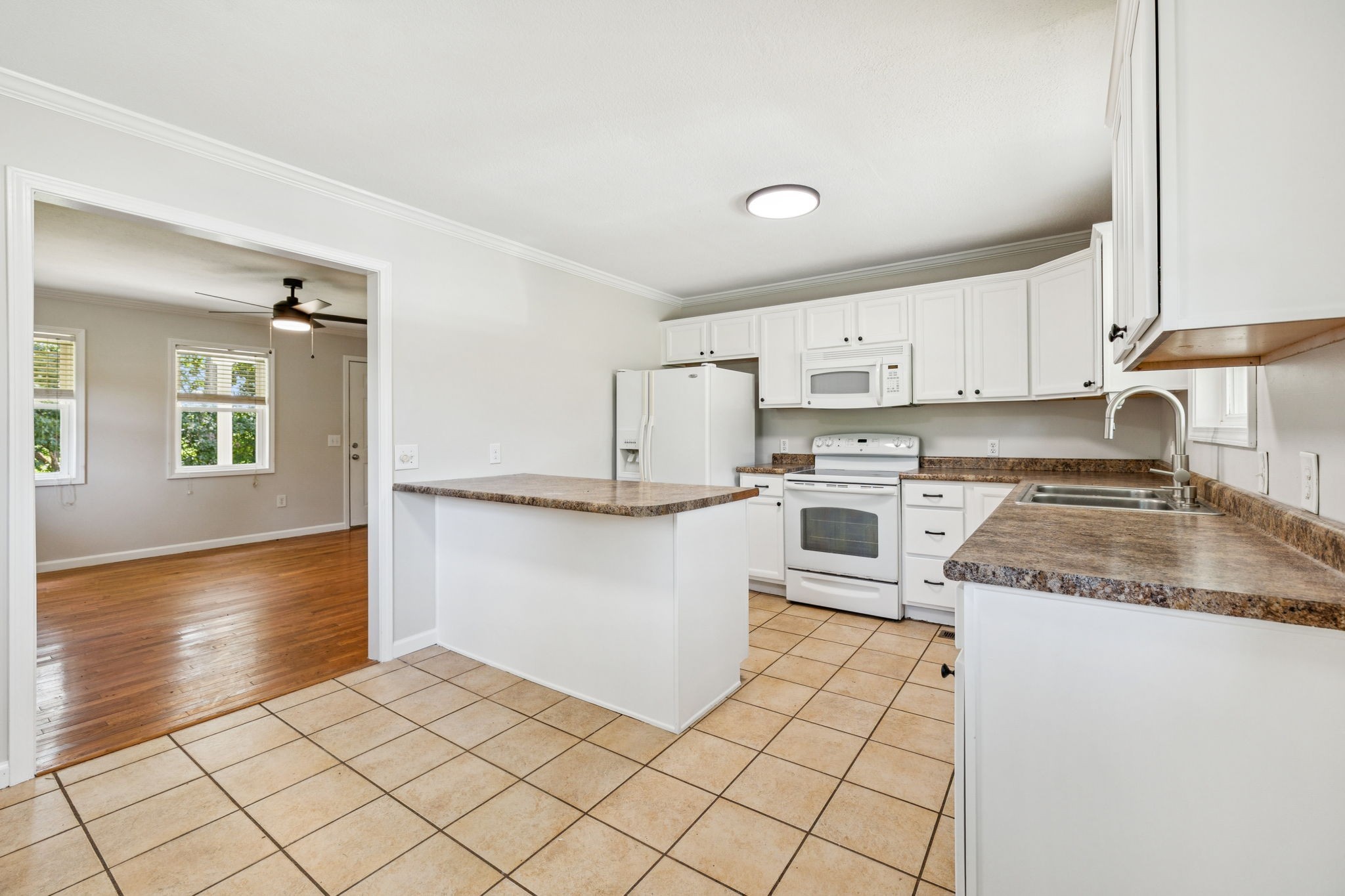 2585 Pow Road Baxter, TN 38544 - Photo 21 of 83 a kitchen with stainless steel appliances granite countertop a stove a sink and a refrigerator