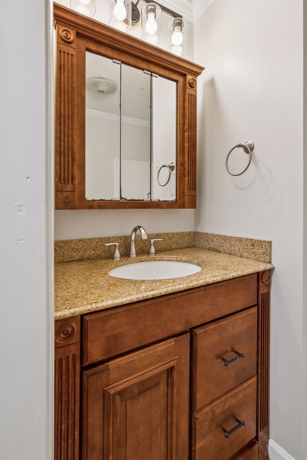 2585 Pow Road Baxter, TN 38544 - Photo 32 of 83 a bathroom with a granite countertop sink and a mirror