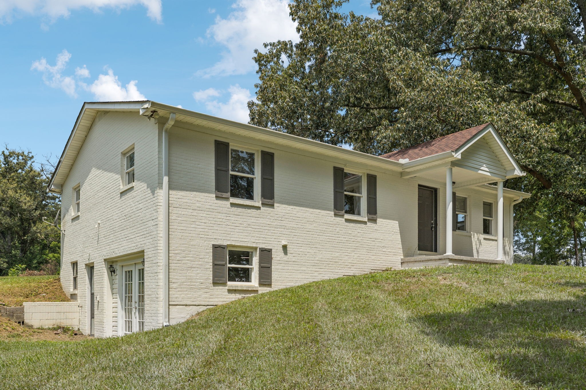 2585 Pow Road Baxter, TN 38544 - Photo 4 of 83 a front view of a house with garden