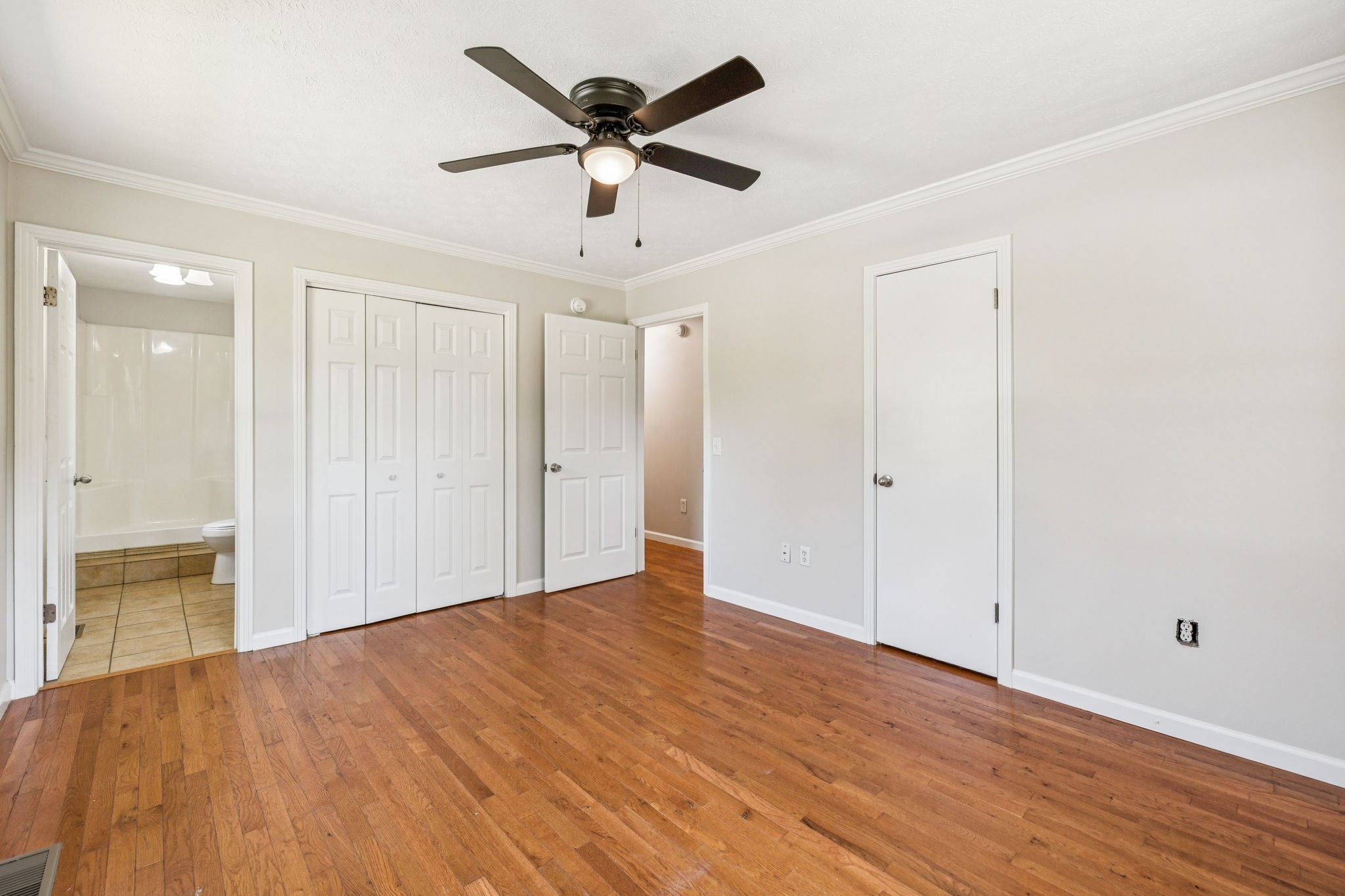 2585 Pow Road Baxter, TN 38544 - Photo 41 of 83 an empty room with wooden floor and ceiling fan